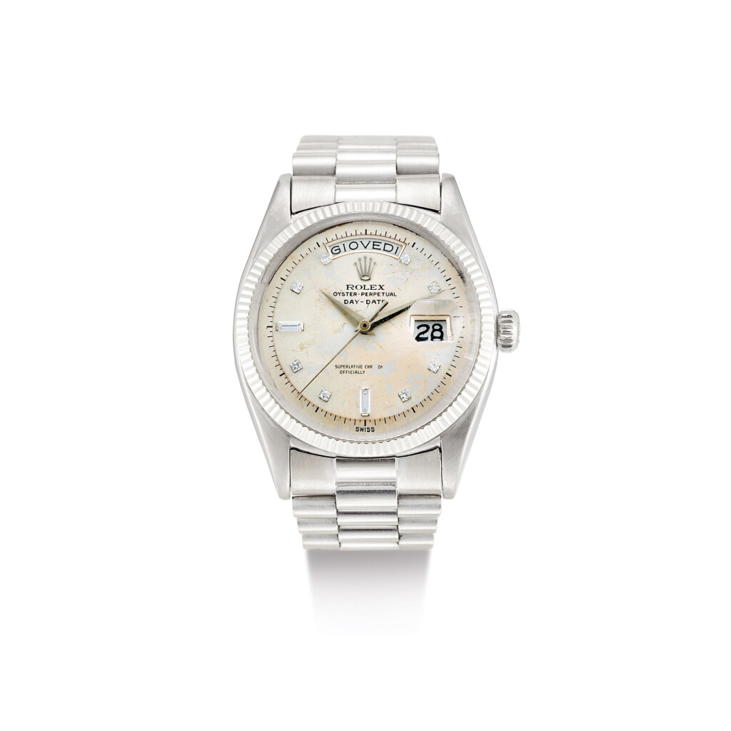 View full screen - View 1 of Lot 2133. ROLEX | DAY-DATE, REFERENCE 6611B, A WHITE GOLD AND DIAMOND-SET WRISTWATCH WITH DAY, DATE AND BRACELET, CIRCA 1958 | 勞力士 | "Day-Date 型號6611B 白金鑲鑽石鏈帶腕錶,備日期及星期顯示,錶殼編號401552,約1958年製".