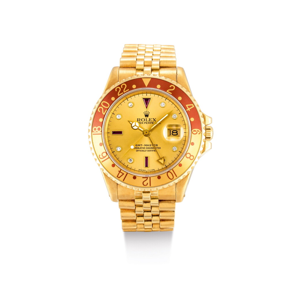 View full screen - View 1 of Lot 2018. ROLEX | GMT-MASTER, REFERENCE 16758, A YELLOW GOLD, DIAMOND AND RUBY-SET DUAL TIME ZONE WRISTWATCH WITH DATE AND BRACELET, CIRCA 1987 | 勞力士 | "GMT-Master 型號16758 黃金鑲鑽石及紅寶石兩地時間鏈帶腕錶,備日期顯示,錶殼編號R288227,約1987年製".