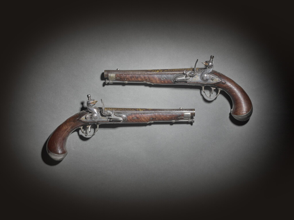 View full screen - View 1 of Lot 223. A pair of mirrored silver-mounted flintlock pistols made for Tipu Sultan, by Asad Amin, India, Seringapatam, dated Mawludi 1223 (1794-95 AD).