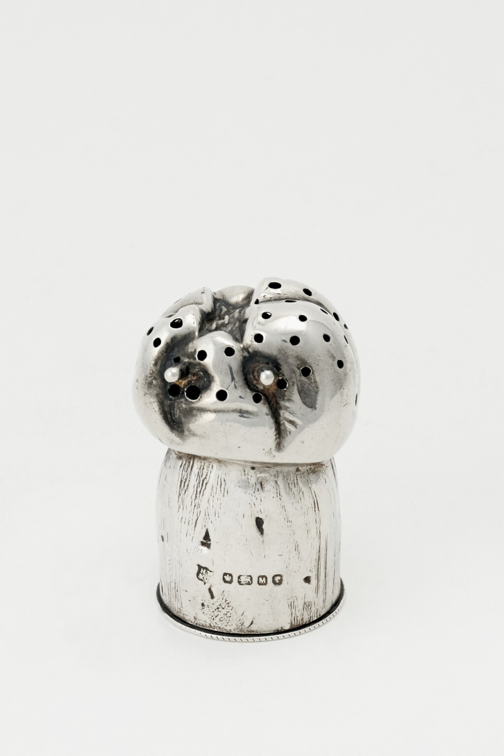 View full screen - View 1 of Lot 47. A VICTORIAN SILVER CHAMPAGNE CORK-FORM PEPPER POT | HENRY WILKINSON & CO., SHEFFIELD | 1879.