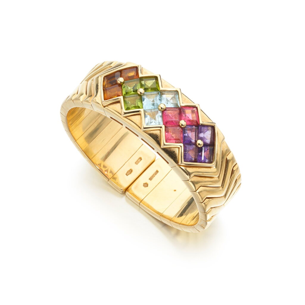 View full screen - View 1 of Lot 834. Gold and gem set bangle, circa 1990.