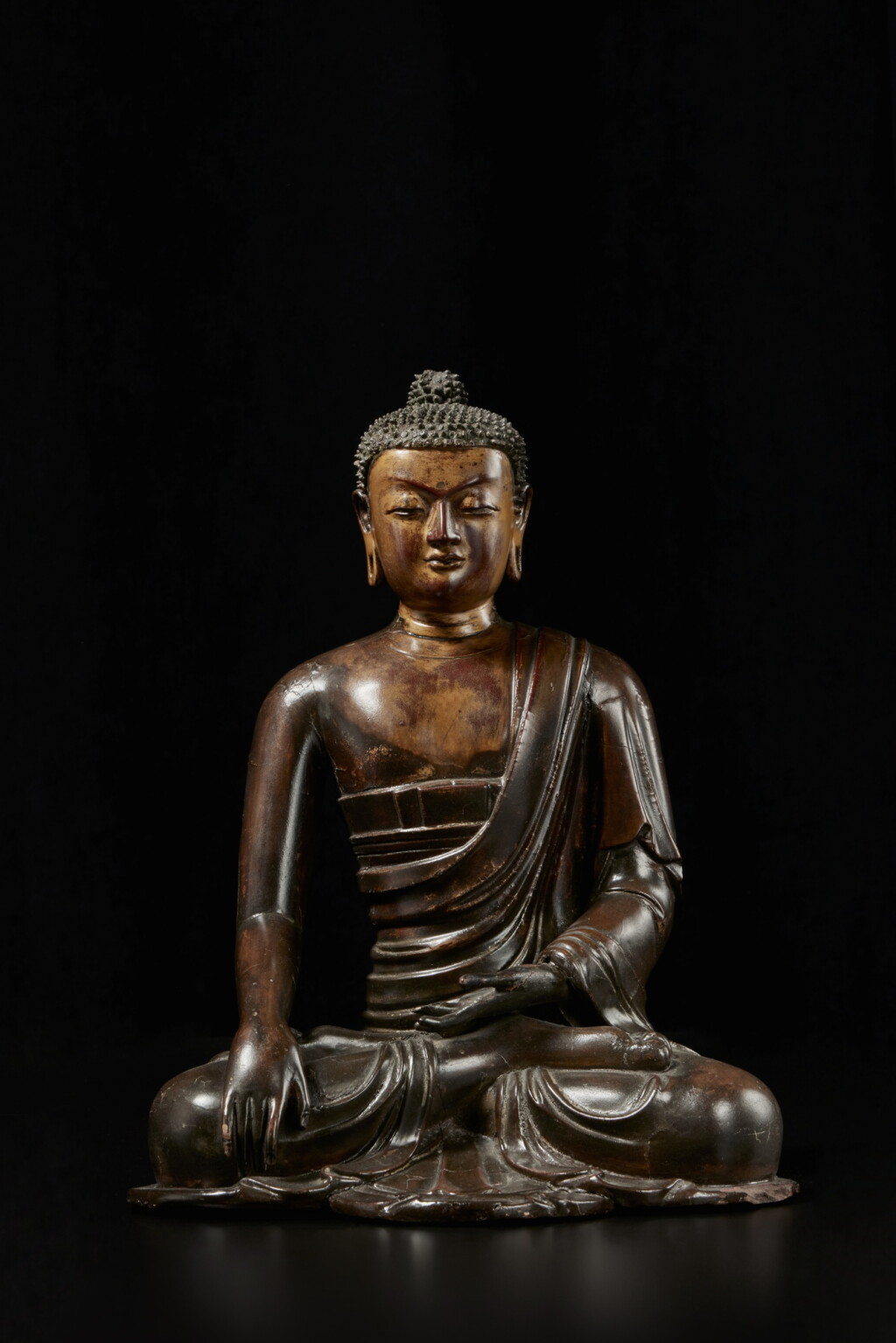 View full screen - View 1 of Lot 304. A gilt-lacquered wood figure of Buddha, Qing dynasty, 18th century.