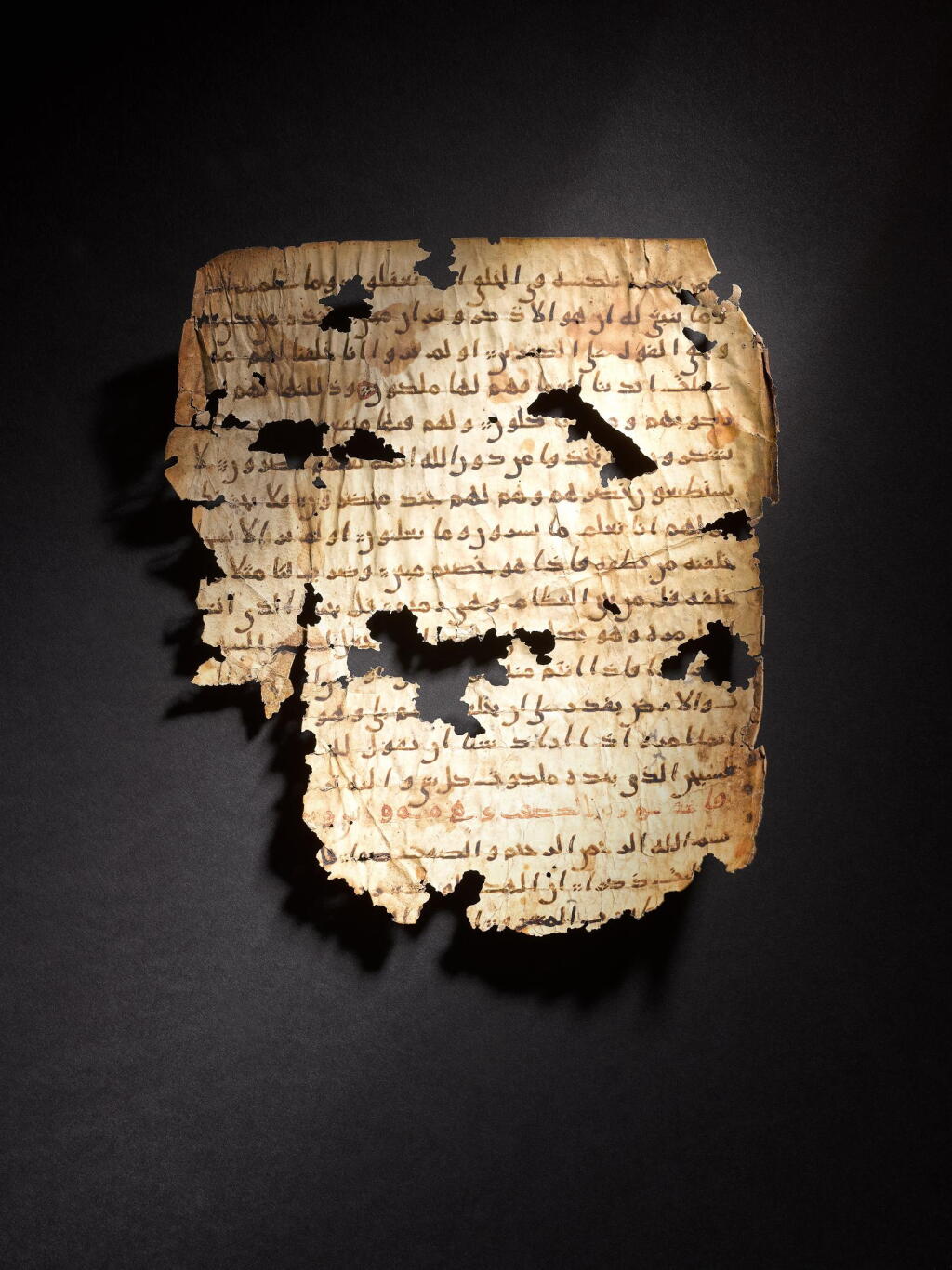 View full screen - View 1 of Lot 504. An early fragmentary Qur'an leaf in Hijazi script on vellum, Arabian Peninsula, second half 7th century AD.