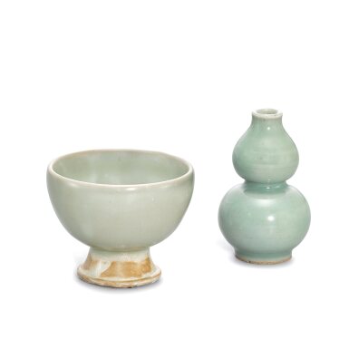 View full screen - View 1 of Lot 340. A Yaozhou moon-white glazed 'fish' stem cup and a small Longquan celadon double-gourd vase, Song - Yuan dynasty 宋至元 耀州月白釉印魚紋高足盃 及 龍泉青釉葫蘆小瓶.