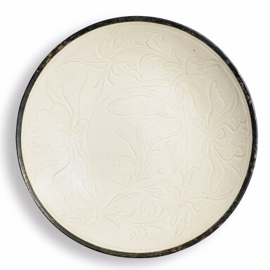 View full screen - View 1 of Lot 227. A rare carved 'Ding' 'lotus' dish, Northern Song dynasty | 北宋 定窰白釉刻蓮紋盤.