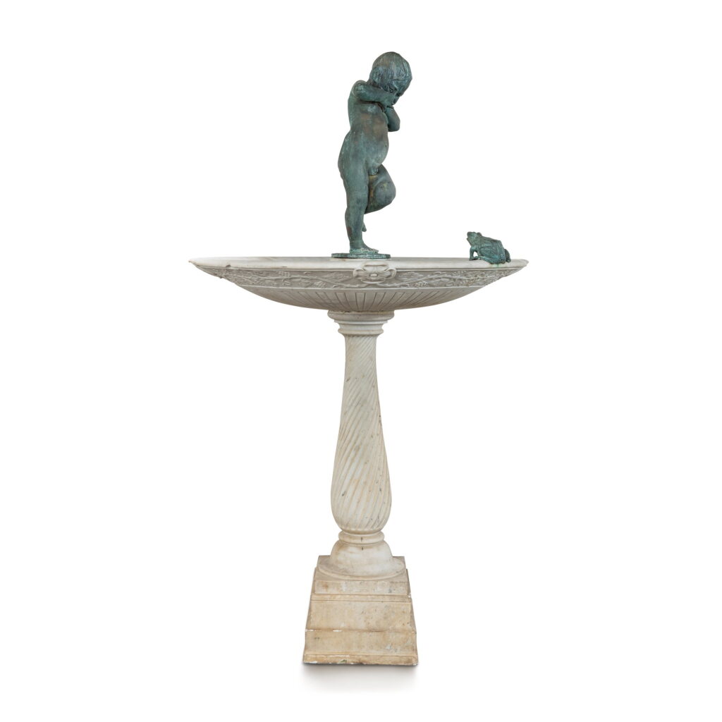 View full screen - View 1 of Lot 670. An Italian Carved White Marble Fountain Surmounted by a Patinated Bronze Figure of a Putto, Signed Raffaello Romanelli, Firenze, Early 20th Century.