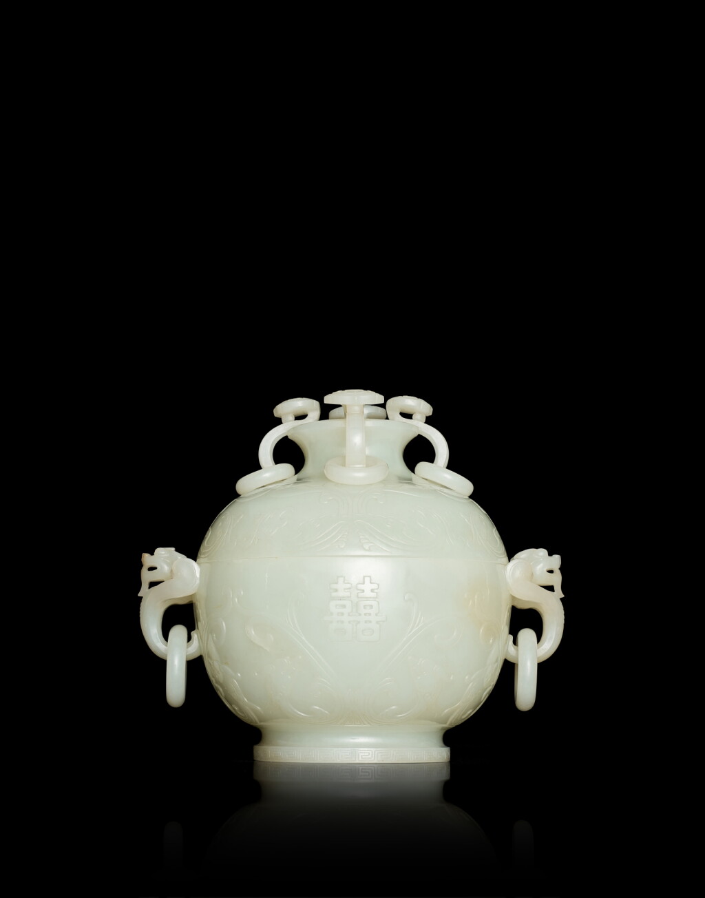 View full screen - View 1 of Lot 3839. A rare white jade 'double happiness' globular marriage bowl and cover, Qing dynasty, Qianlong period | 清乾隆 白玉活環耳仿古夔龍雙囍蓋奩.
