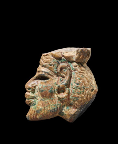 View full screen - View 1 of Lot 145. An Egyptian Glazed Steatite Profile Head of an Asiatic, 18th/19th Dynasty, 1540-1190 B.C..