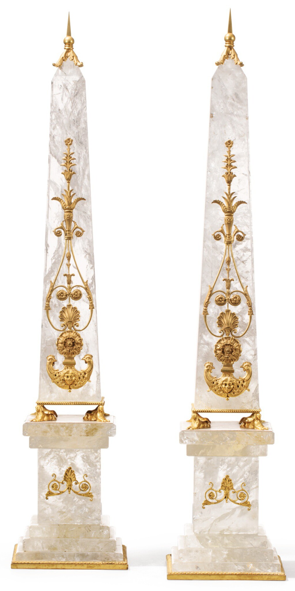 View full screen - View 1 of Lot 48. A PAIR OF GILT-BRONZE-MOUNTED ROCK CRYSTAL OBELISKS IN FRENCH RESTAURATION STYLE | PAIRE D'OBÉLISQUES EN CRISTAL DE ROCHE ET MONTURE DE BRONZE DORÉ SUR LEUR SOCLE, DE STYLE RESTAURATION.