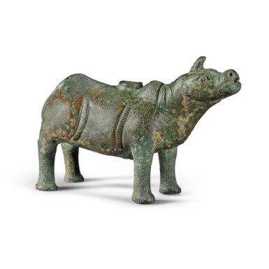 View full screen - View 1 of Lot 139. A SMALL BRONZE 'RHINOCEROS' WATER-DROPPER, SONG DYNASTY OR LATER | 宋或以後 銅犀牛形水注.