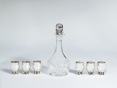 View full screen - View 1 of Lot 27. A Set of Six Small Danish Silver Grapevine Pattern Cups, No. 296B, and Cut-Glass Decanter with Silver Stopper, No. 100C, Georg Jensen Silversmithy, Copenhagen, 1945–1977.