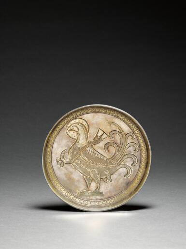 View full screen - View 1 of Lot 514. An early Islamic or post-Sassanian silver gilt dish depicting a bird, Persia, 6th-8th century.