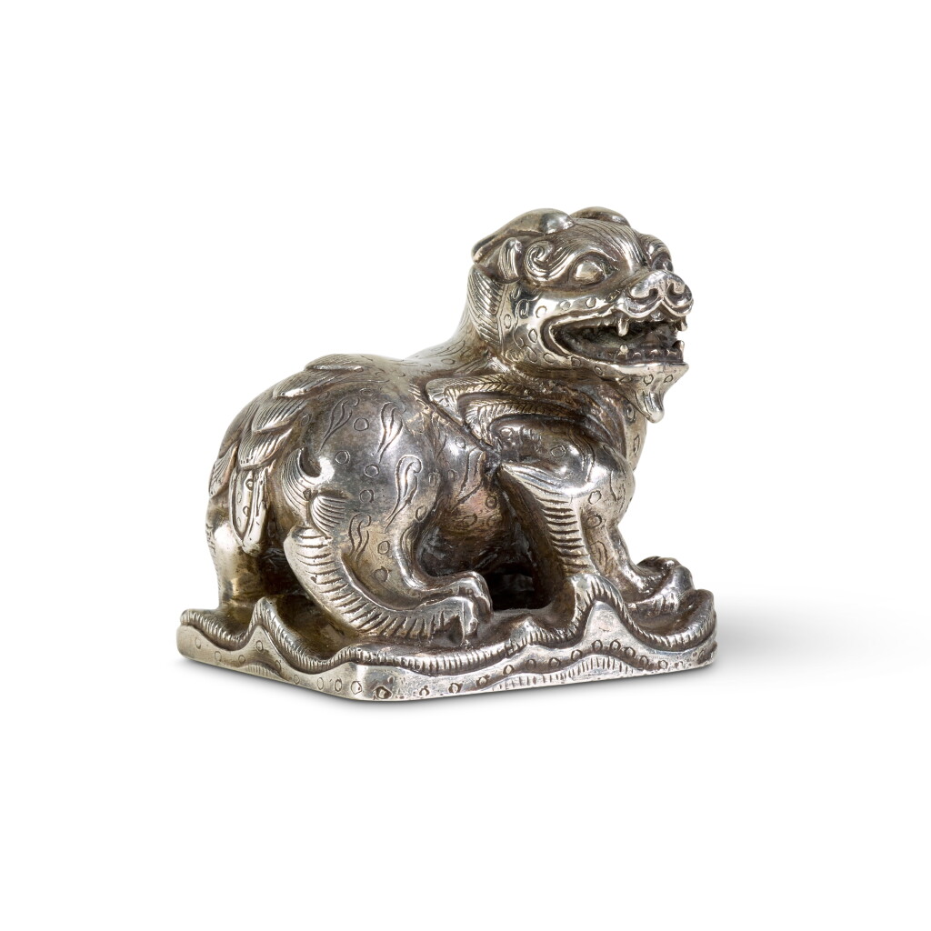 View full screen - View 1 of Lot 427. A silver 'lion' scroll weight | 銀瑞獅鈕鎮.