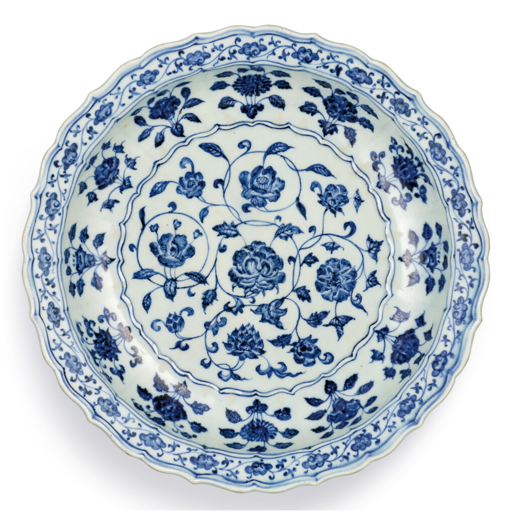 View full screen - View 1 of Lot 3607. A FINE BLUE AND WHITE 'FLORAL' BARBED CHARGER MING DYNASTY, YONGLE PERIOD | 明永樂 青花花卉紋菱口折沿盤.