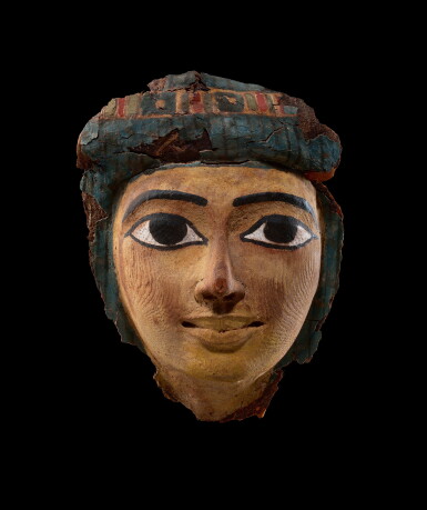 View full screen - View 1 of Lot 208. An Egyptian Polychrome Wood Mummy Mask, 21st/22nd Dynasty, 1075-716 B.C..