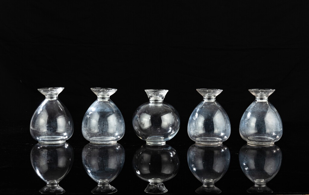 View full screen - View 1 of Lot 1280. Set of four Lotus decanters and one Coquelicot decanter.