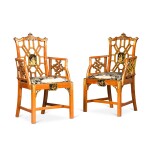 A pair of English gilt and black japanned satinwood armchairs, circa 1920-30, attributed to S. Hille & Co