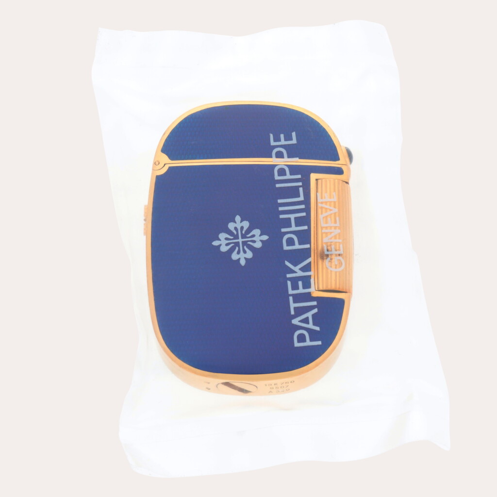 View full screen - View 1 of Lot 292. Golden Ellipse, Reference 9507 | A service sealed yellow gold and blue enamel lighter | Circa 1980.