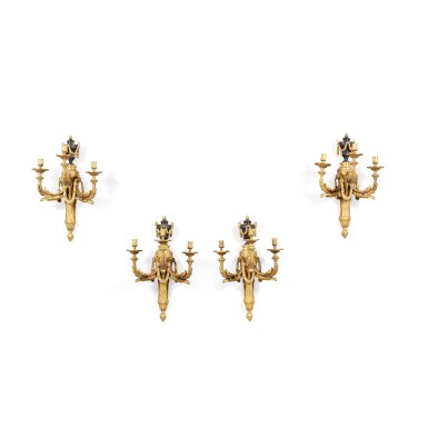 View full screen - View 1 of Lot 211. A set of four Restauration patinated and gilt-bronze three-light wall-lights, circa 1825 | Suite de quatre appliques à trois lumières en bronze patiné et doré d'époque Restauration, vers 1825.