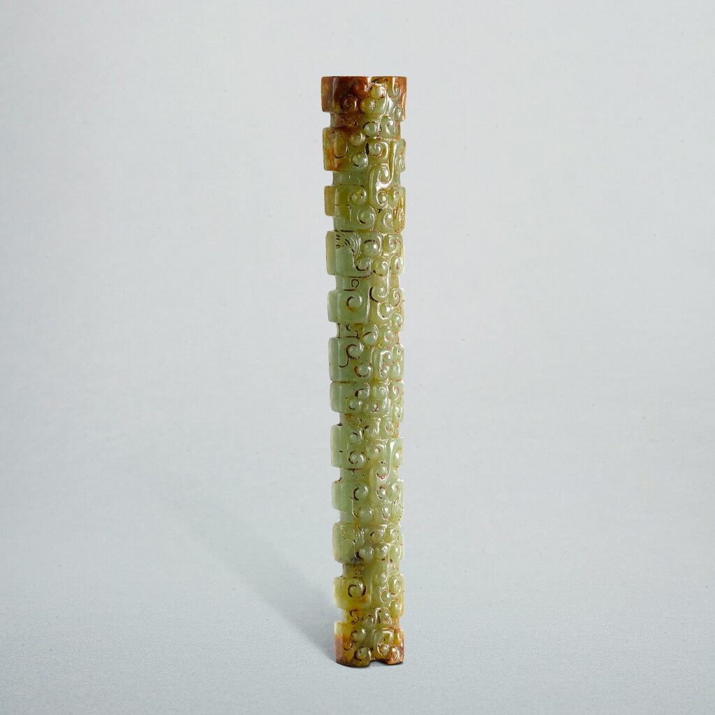 View full screen - View 1 of Lot 730. A celadon jade 'panhui' bead, Eastern Zhou dynasty, Spring and Autumn period | 東周春秋 青玉蟠虺紋扁管形珮.