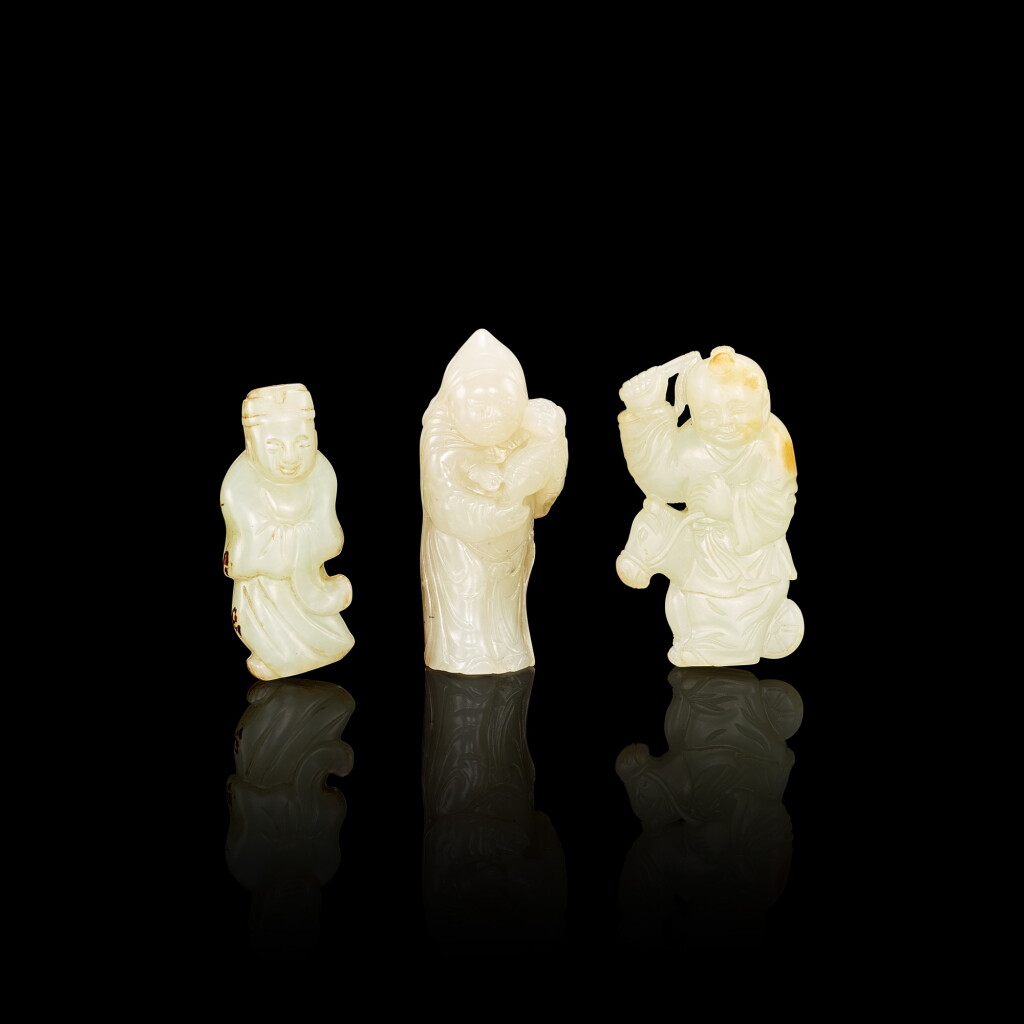 View full screen - View 1 of Lot 3045. A group of three pale celadon jade standing figures, 17th - 18th century 十七至十八世紀 青白玉人物立像三件.