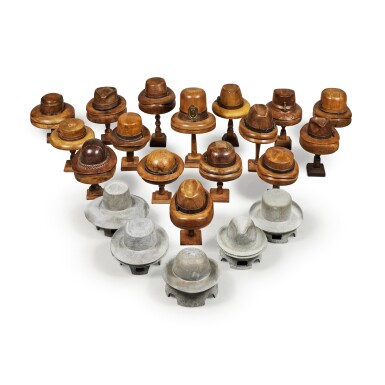 View full screen - View 1 of Lot 32. A Collection of Five Cast-Iron Hat Moulds, together with Sixteen Carved Wood Models of Hats.
