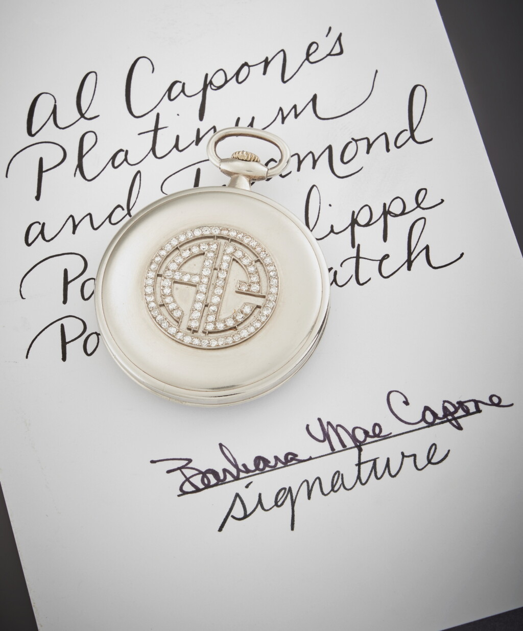 View full screen - View 1 of Lot 13. A platinum and diamond-set keyless wind open face watch, Formerly owned by Al Capone, Circa 1919.
