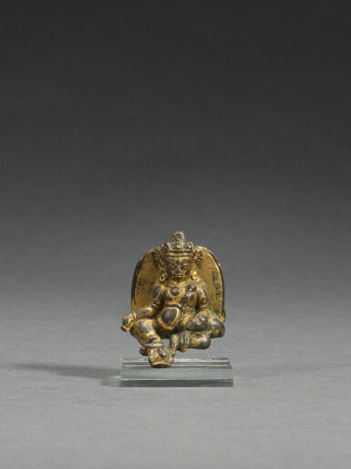 View full screen - View 1 of Lot 71. A miniature gilt-copper alloy figure of Jambhala, Tibet, 14th/15th century | 十四/十五世紀 藏傳鎏金銅合金黃財神.