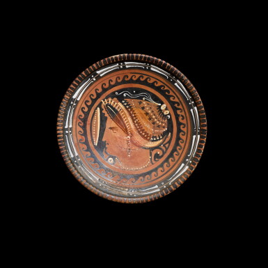 View full screen - View 1 of Lot 182. An Apulian Red-figured Pottery Plate, circa 340-320 B.C..