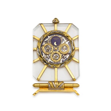 View full screen - View 1 of Lot 8284. A two colour gold and rock crystal skeletonised perpetual calendar desk clock with moon phases and incomplete stand, Circa 1990 | 雙色金及白水晶鏤空萬年曆座鐘,備月相顯示及不完整底座,約1990年製.
