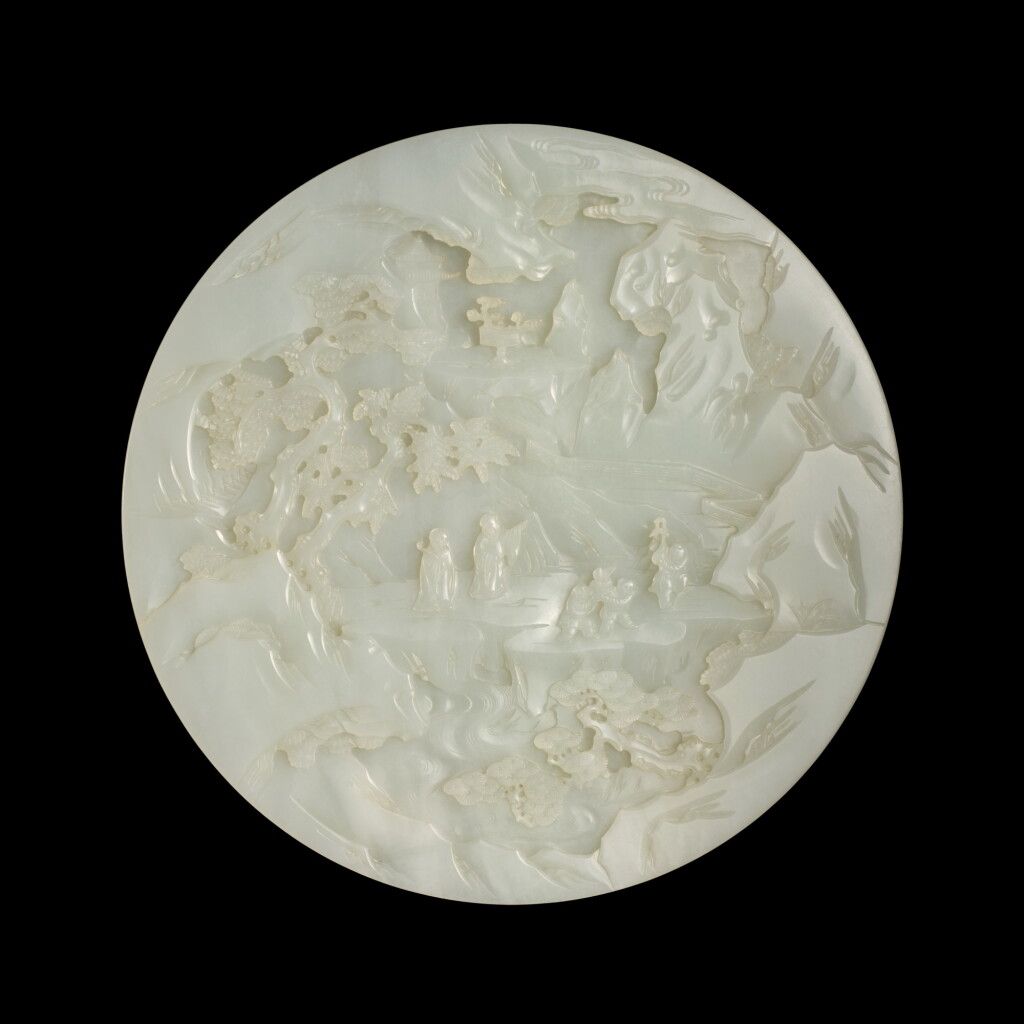View full screen - View 1 of Lot 523. A finely carved white jade 'figural' circular table screen, Qing dynasty, Qianlong period | 清乾隆 白玉雕祝壽圖插屏.