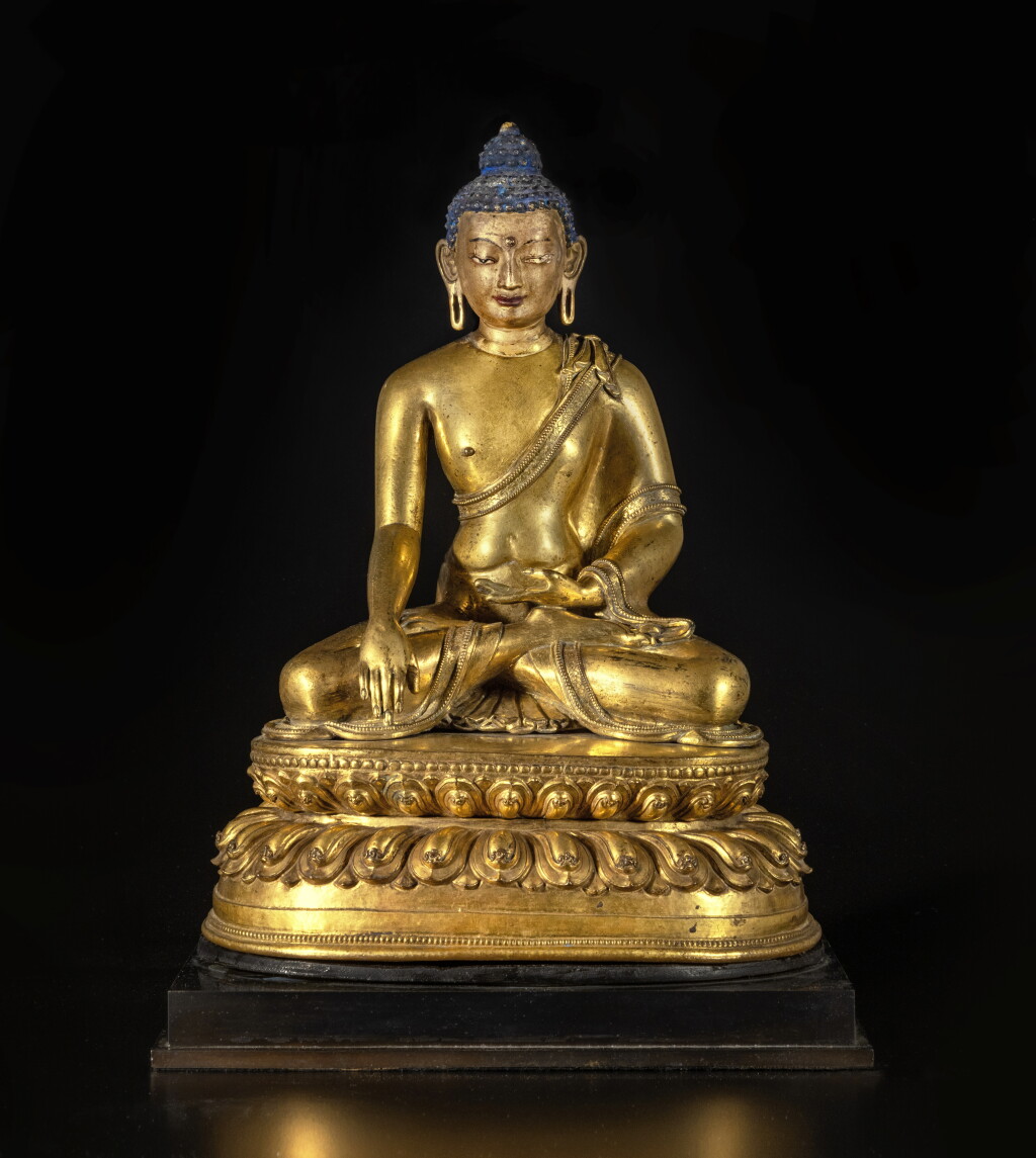 View full screen - View 1 of Lot 565. A large inscribed gilt copper alloy figure of Shakyamuni Buddha, Tibet, circa 15th century.