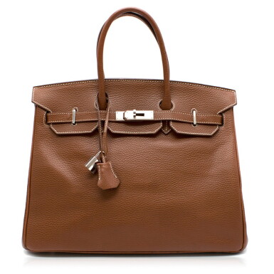 View full screen - View 1 of Lot 2. Birkin 35 Miel Colour Taurillion in Clemence Leather, with white contrast stitching and palladium hardware. Hermès. 2008..