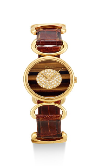 View full screen - View 1 of Lot 8165. PIAGET | REFERENCE 9802 B, A YELLOW GOLD AND DIAMOND-SET WRISTWATCH WITH TIGER EYE DIAL, CIRCA 1972.