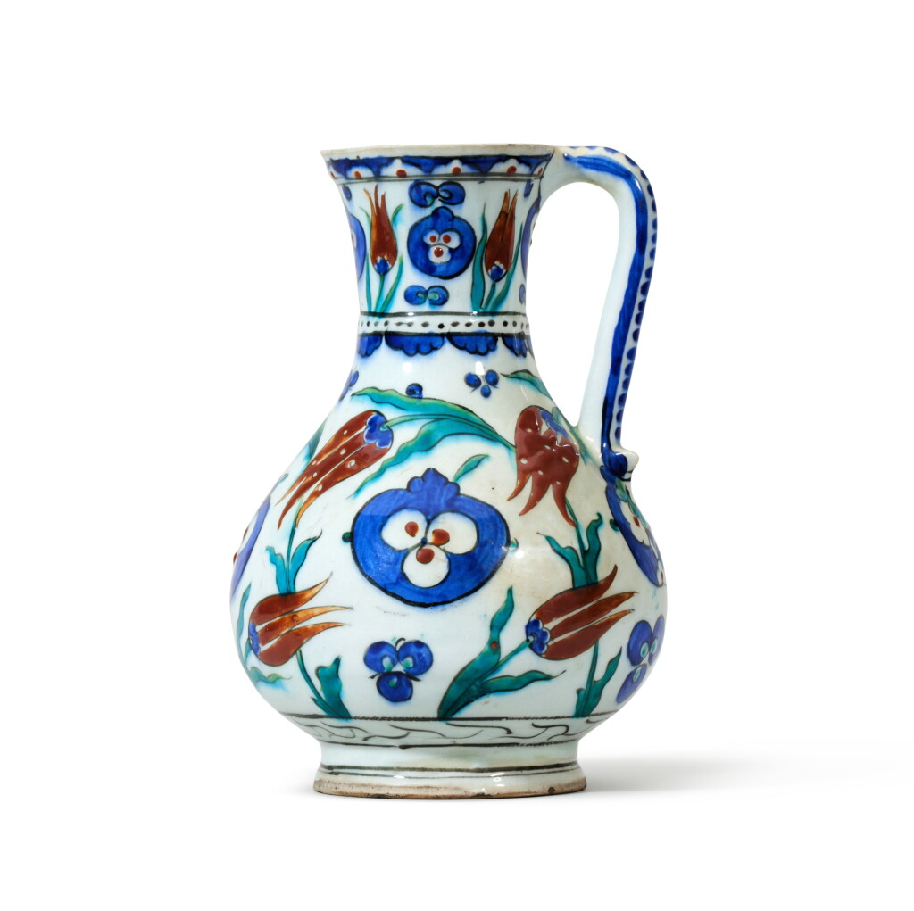 View full screen - View 1 of Lot 18. An Iznik Polychrome Pottery Jug, Turkey, Ottoman, Circa 1575 | Eine polychrome Iznik-Keramik Kanne, Türkei, Osmanisch, um 1575.