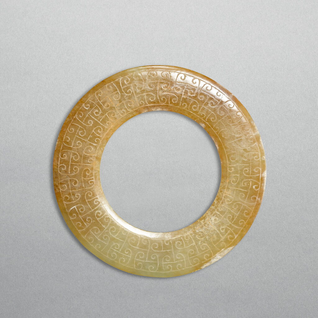 View full screen - View 1 of Lot 744. A white jade disc, huan, Western Han dynasty | 西漢 勾雲紋白玉環.
