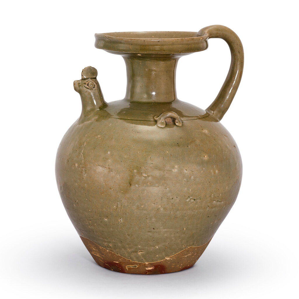View full screen - View 1 of Lot 431. A rare Yue celadon chicken-head ewer, Western Jin dynasty 西晉 越窰青釉雞首壺.
