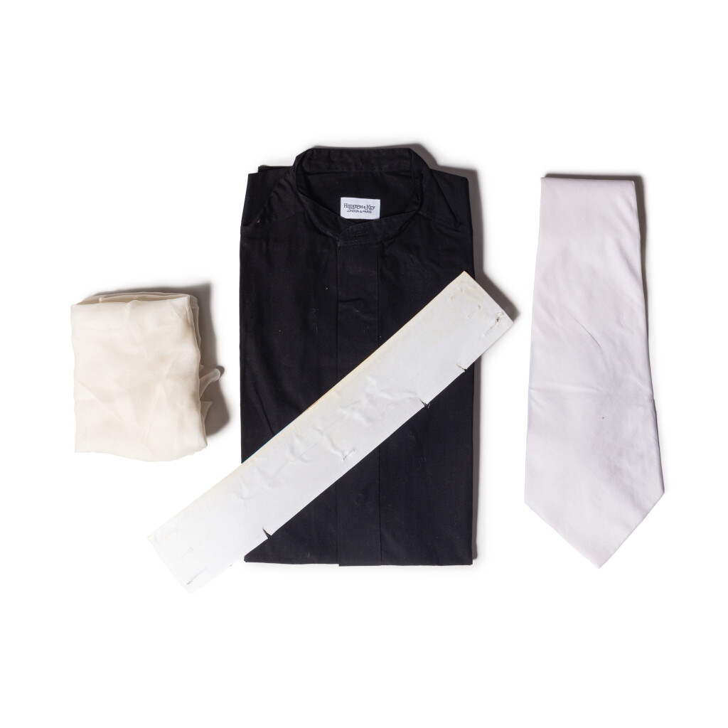 View full screen - View 1 of Lot 47. Set of Four : A Black Sleeveless Worn Shirt, A Worn White Collar, A White Tie and A White Scarf.