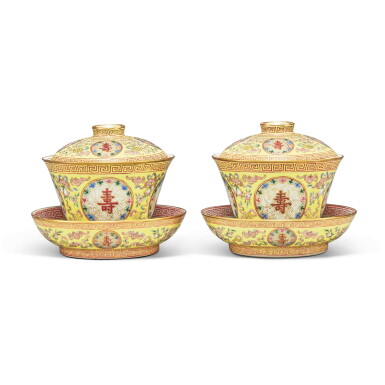 View full screen - View 1 of Lot 540. A pair of yellow-ground famille-rose 'longevity' bowls, covers, and dishes, Qing dynasty, Tongzhi period | 清同治 黃地粉彩開光「萬壽無疆」蓋盌連托兩套 《長春同慶》款.