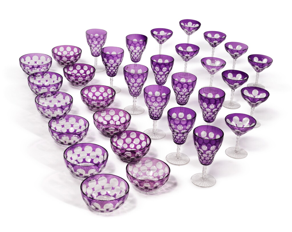 View full screen - View 1 of Lot 321. AN AMETHYST-OVERLAY AND CUT GLASS TABLE SERVICE, 20TH CENTURY.