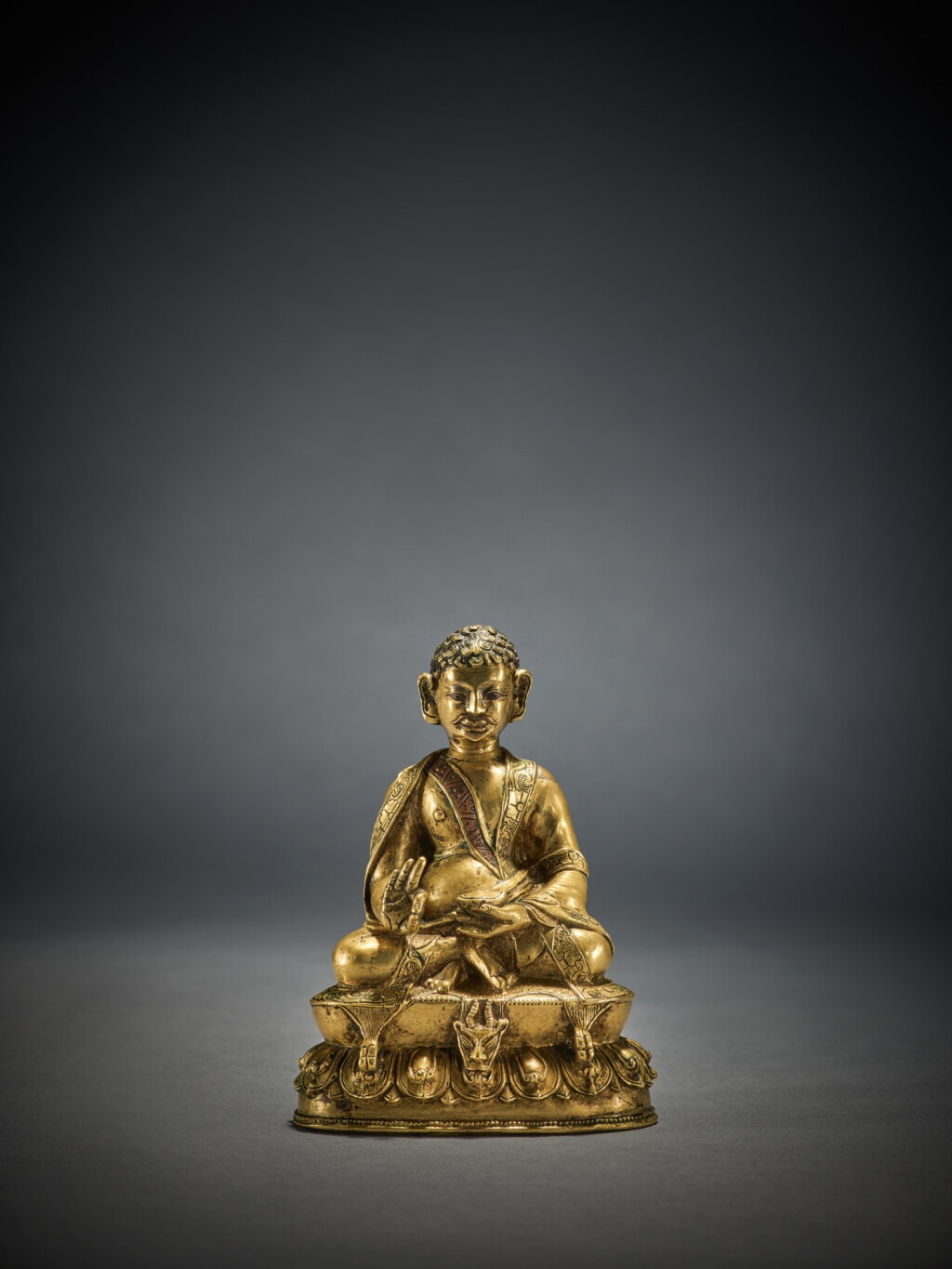 View full screen - View 1 of Lot 337. A Copper Alloy Figure of Milarepa with Silver and Copper Inlay, Tibet, 16th Century.