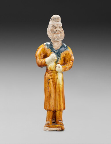 View full screen - View 1 of Lot 17. A sancai-glazed pottery figure of a standing camel groom , Tang dynasty | 唐 三彩胡人立像.