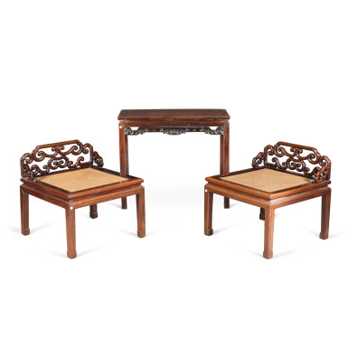 View full screen - View 1 of Lot 136. A 'hongmu' corner-leg side table, 19th / 20th century | 十九 / 二十世紀 紅木束腰條案 及 二十世紀 紅木玫瑰椅 一對.