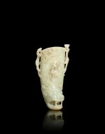 A pale celadon and russet jade 'chilong' rhyton, Qing dynasty, 17th - 18th century | 清十七至十八世紀 青白玉螭龍花插
