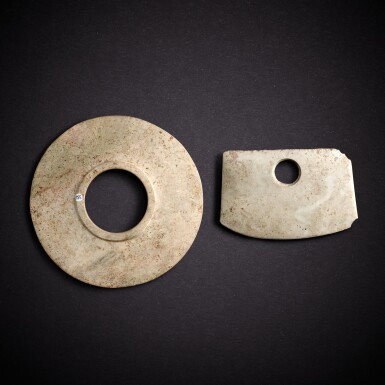 View full screen - View 1 of Lot 7826. A jade collared disc, bi, and a jade axe, fu, Shang dynasty | 商 玉有領璧及玉斧.