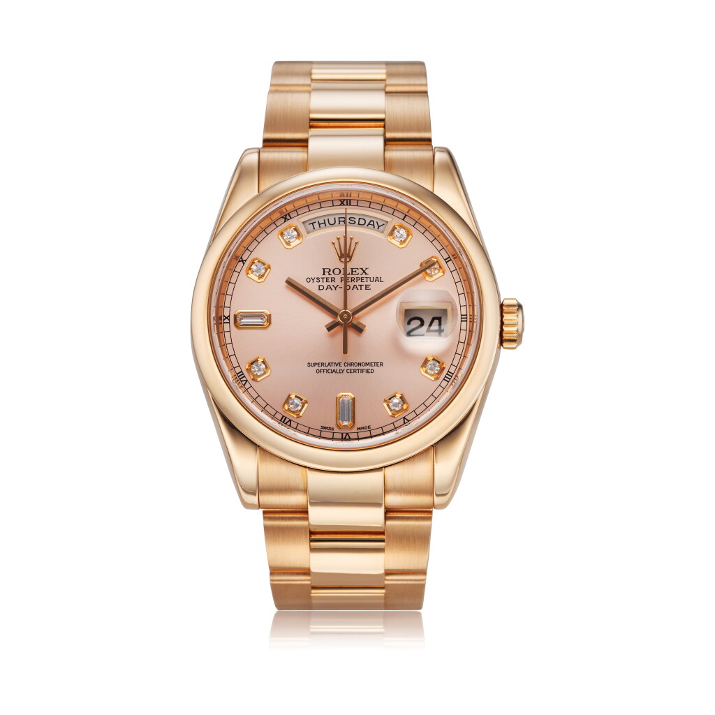 View full screen - View 1 of Lot 317. Reference M118205 A pink gold and diamond-set automatic wristwatch with day, date and bracelet, Circa 2005.