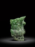 A spinach-green jade archaistic 'phoenix' rhyton, Qing dynasty, 18th century | 清十八世紀 碧玉雕仿古祥鳳螭龍觥