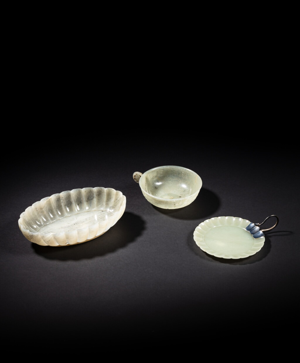 View full screen - View 1 of Lot 70. A group of three Mughal-style celadon jade objects, Qing dynasty, 19th century .
