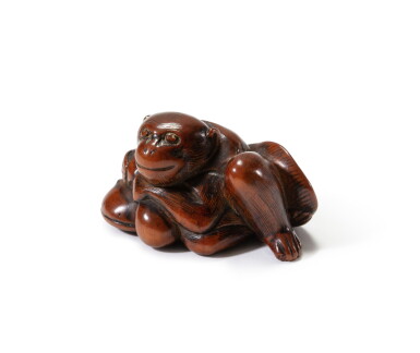 View full screen - View 1 of Lot 188. A carved wood study of a monkey clutching the back of a catfish Japan, Edo period | 日本 江戶時代 木雕猴子抱魚根付.