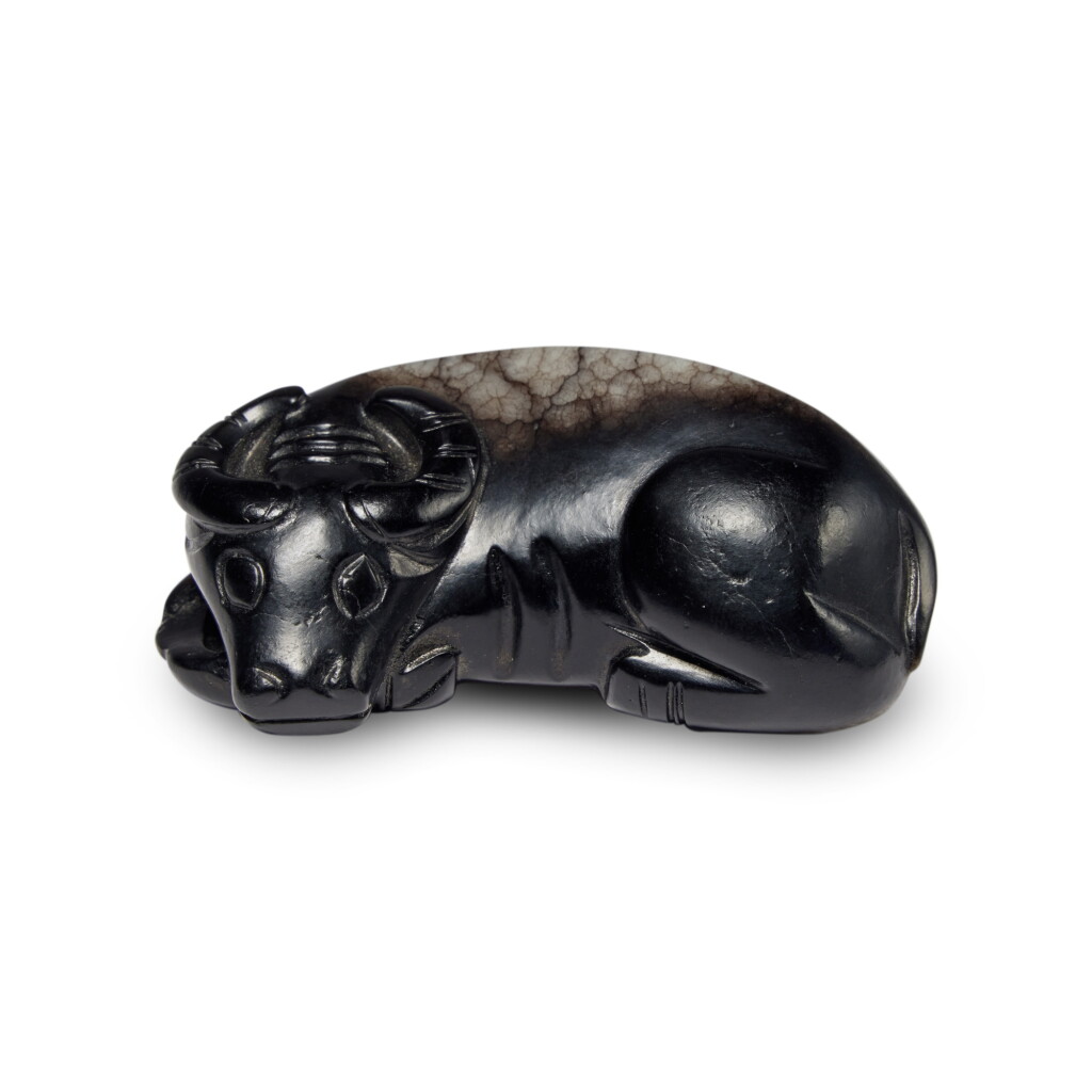 View full screen - View 1 of Lot 45. A black jade carving of a water buffalo, Qing dynasty | 清 玉雕水牛把件.